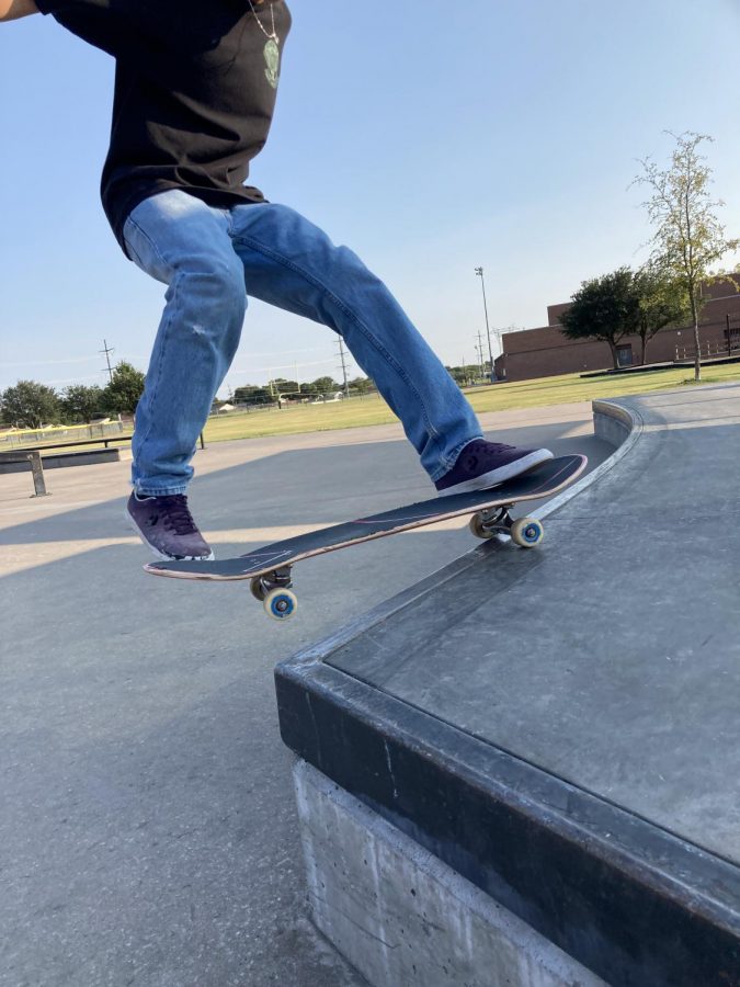 The skateboard hits the side of the rail while I try to complete a 5-O trick. 