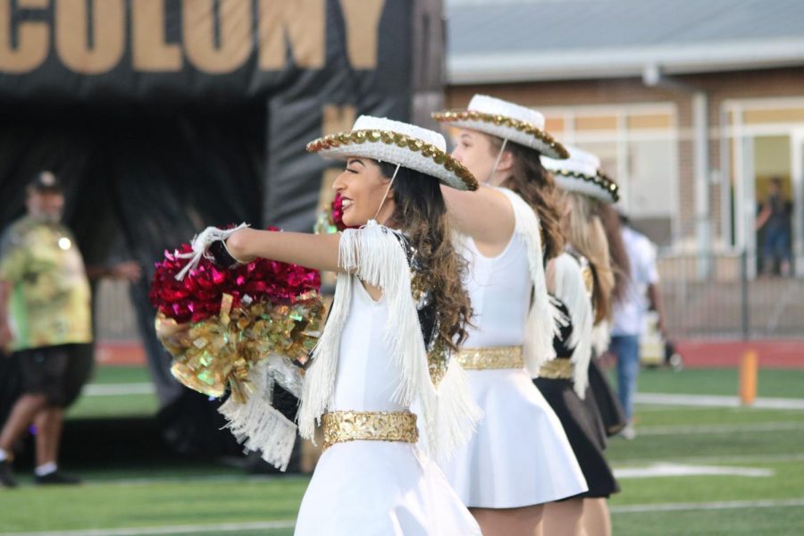 Topcat Officer Christina Delacruz (12) holds her pink poms at the Pink Out game. 