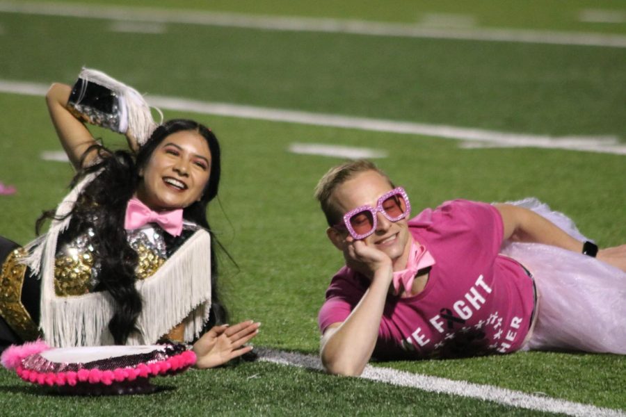 Katelyn Guia (12) danced with assistant principal Bradley Willi during the half time show at the Pink Out game Oct. 15. 
