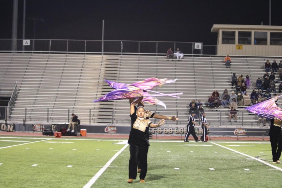 The color guard performs Seraph for the halftime show Oct. 15. 
