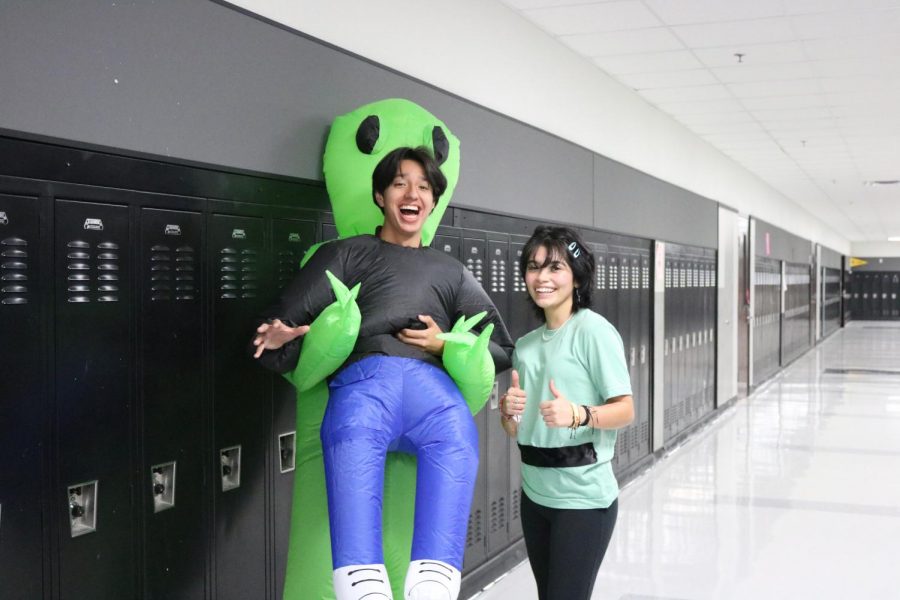 Seniors Adrian Morales and Gabriela Hernandez dress up as an alien abducting a human and Buttercup from the Powerpuff girls. 
