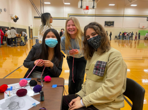 Juniors right to left Eden Viles, Madison Husted, and Diana Ton make their own aromatherapy bracelets 

