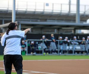 Coach Coleman coaches from the sidelines. She has been a softball coach for 24 years.