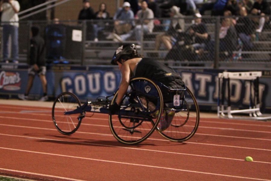 Molnar competes in the wheelchair 100m dash at the TC Invitational. 