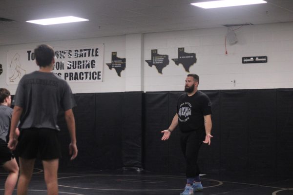 Head wrestling coach makes an impact using accountability, discipline